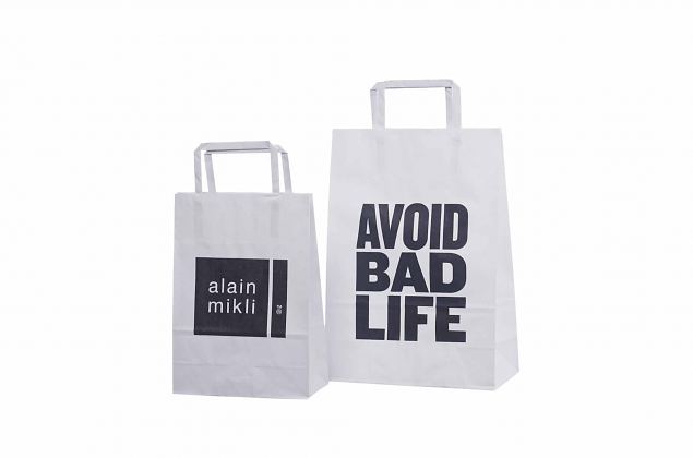 valkoiset litte�kannikkeiset paperikassit omalla painatuksella 